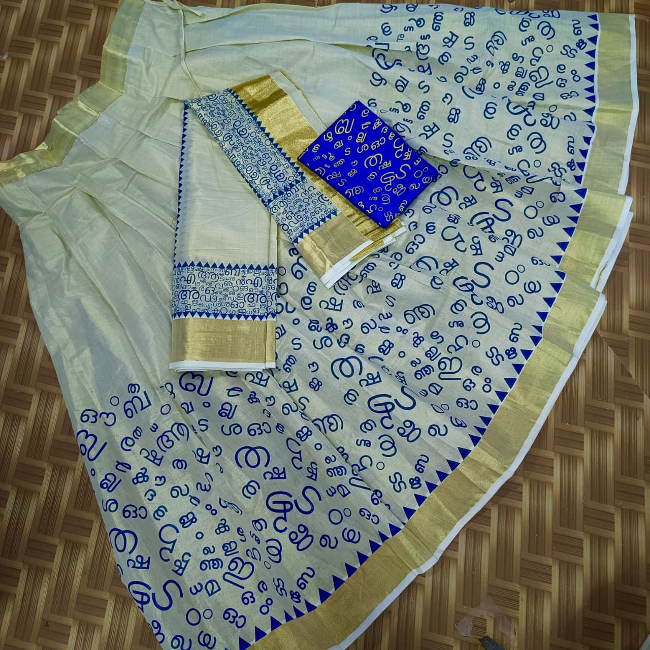 Aksharamala Golden Tissue Saree with Lotus Border & Hand Knot Tassels