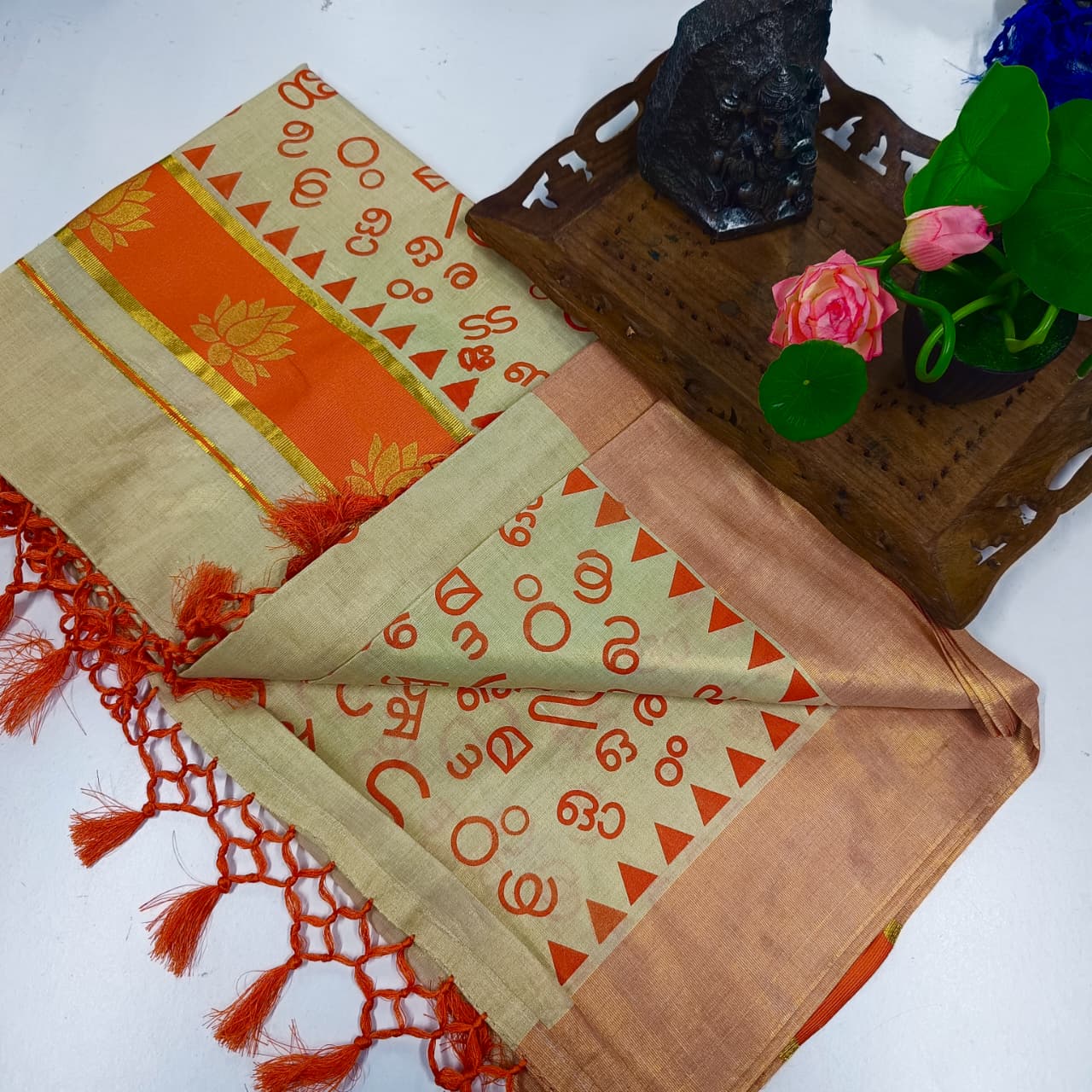 Aksharamala Golden Tissue Saree with Lotus Border & Hand Knot Tassels