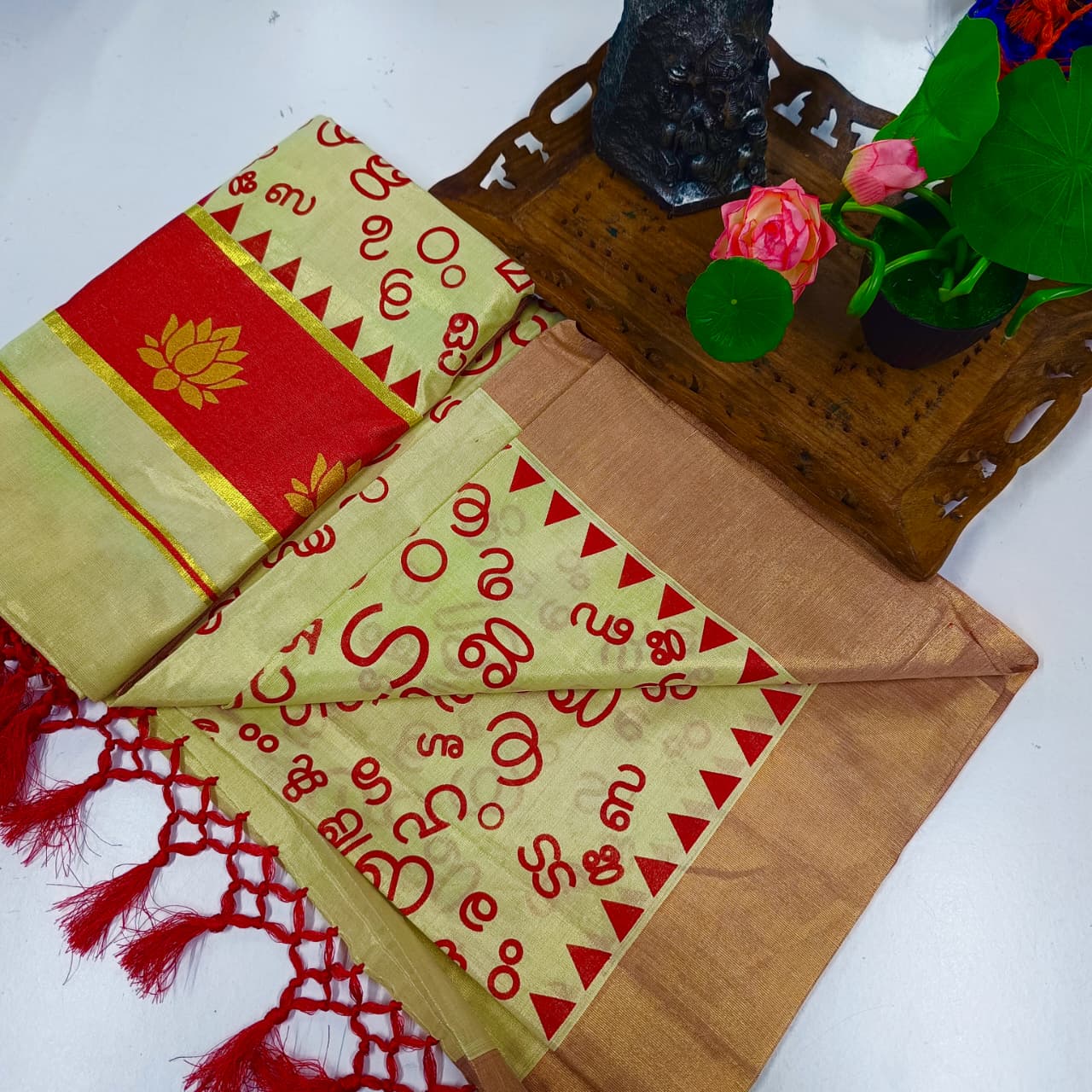 Aksharamala Golden Tissue Saree with Lotus Border & Hand Knot Tassels